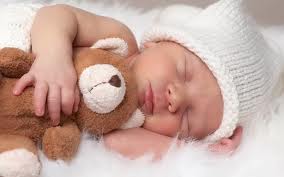 sleeping baby with teddy
